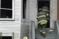 Firefighters enter the building